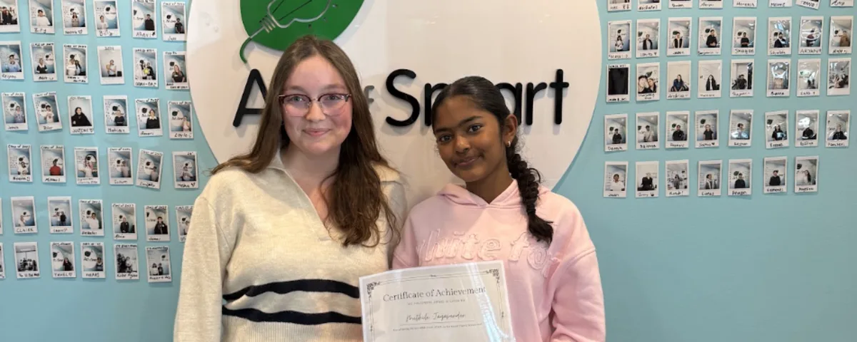 Art of Smart tutor and student celebrating a Certificate of Achievement