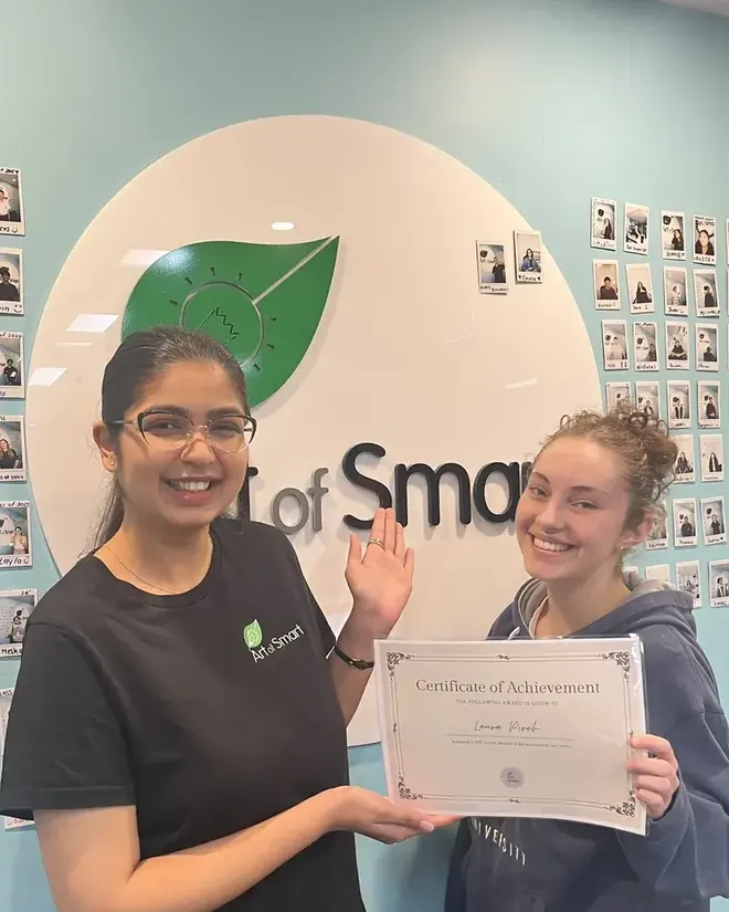 Art of Smart tutor and student celebrating a Certificate of Achievement